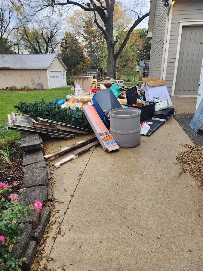 Dumpster being loaded with debris for 3 Yard Dumpster Rental in North Versailles